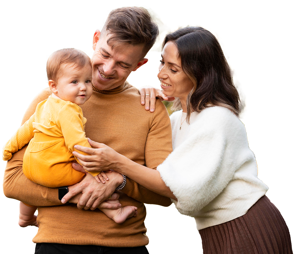 Warm family smiling and holding their baby at Mittagong Doctors.
