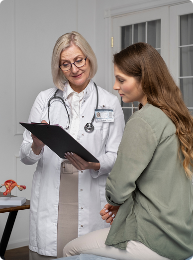 Female GP discussing a care plan with a young woman while reviewing a clipboard at Mittagong Doctors.